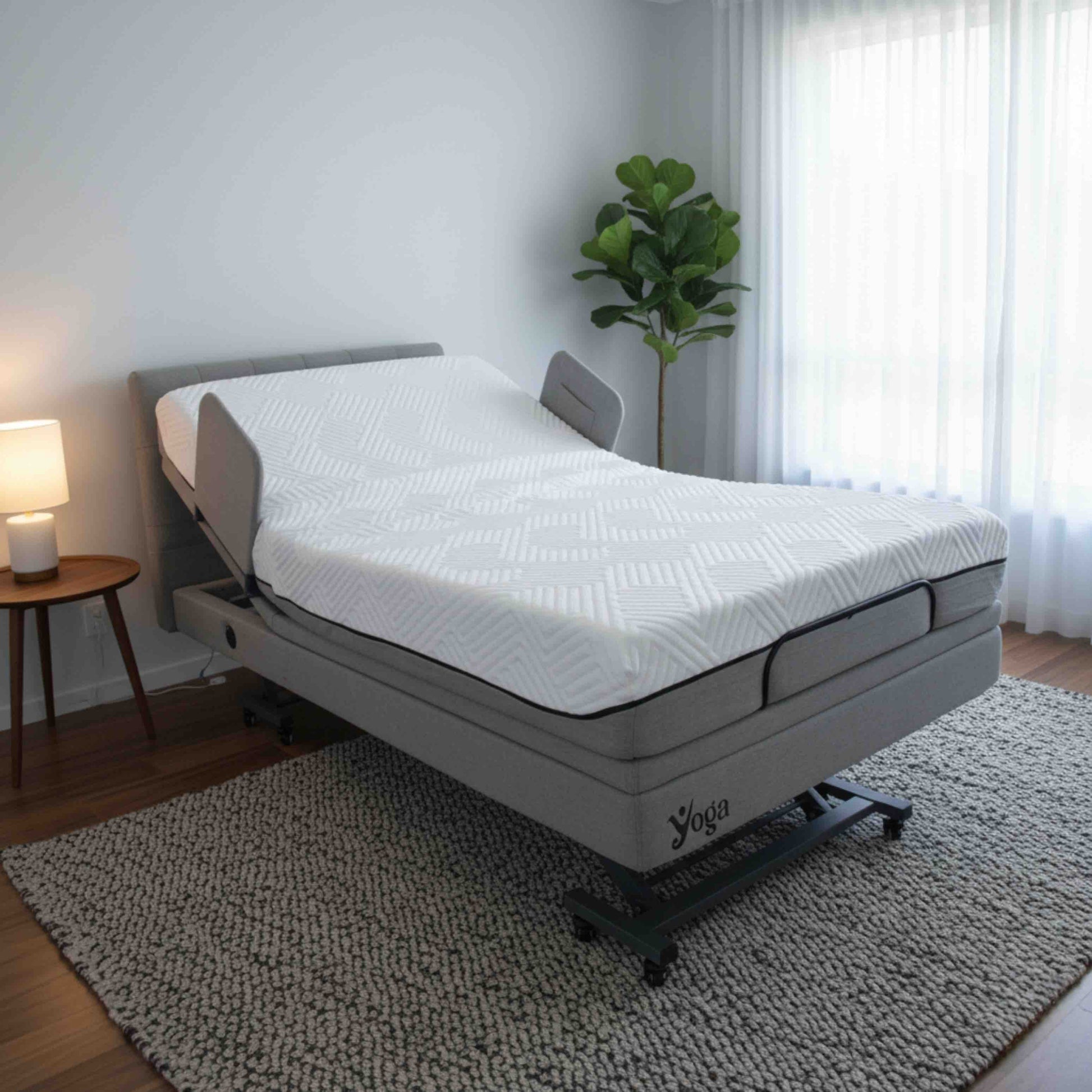 Yoga mattress on an adjustable home care bed in a bedroom setting with a plant and lamp.