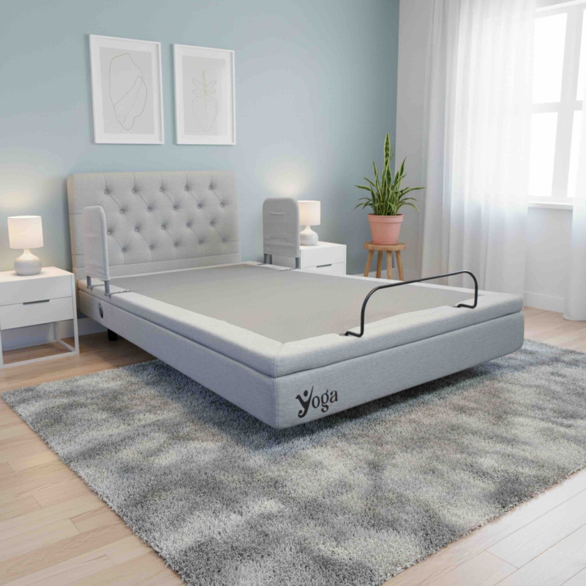 Gray adjustable home care bed in a bedroom setting with 'Yoga' branding.