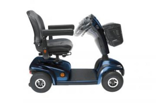 A compact blue Invacare Leo mobility scooter with a black seat, basket in front, and four wheels from Adaptive Equipment (Image 2).