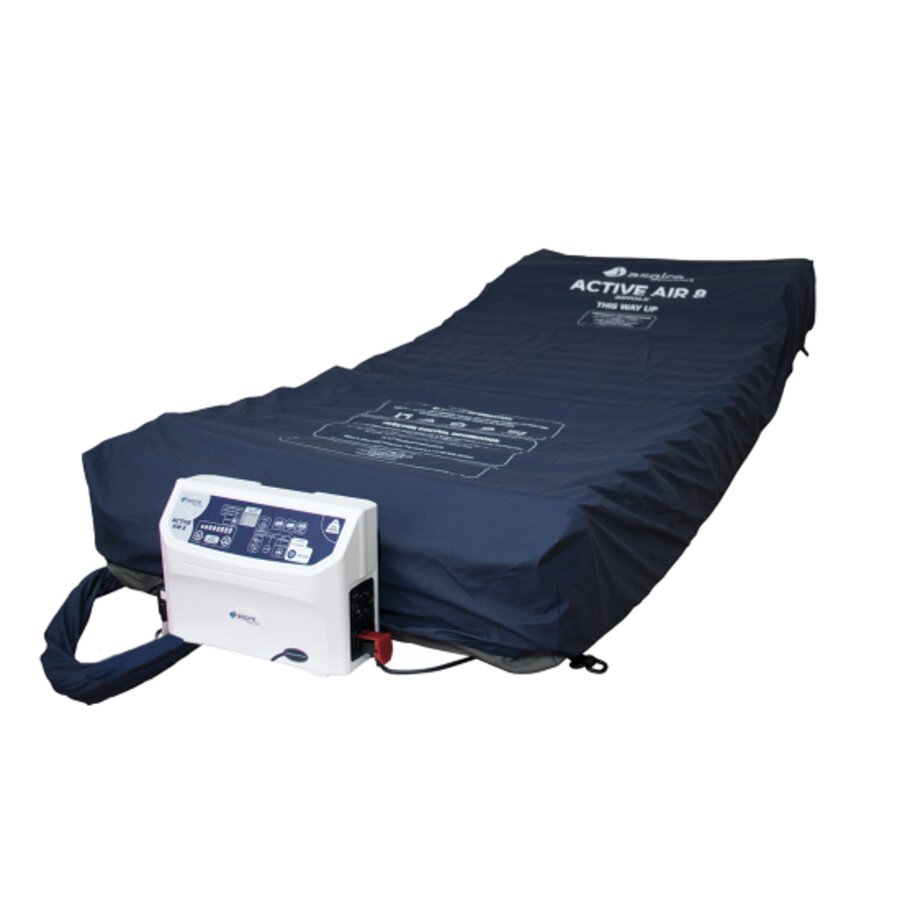 An alternating air mattress designed for pressure relief, showing the mattress itself and the digital pump connected to it (Image 2).