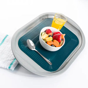 dycem anchor pad rectangle on a tray with a glass and a spoon