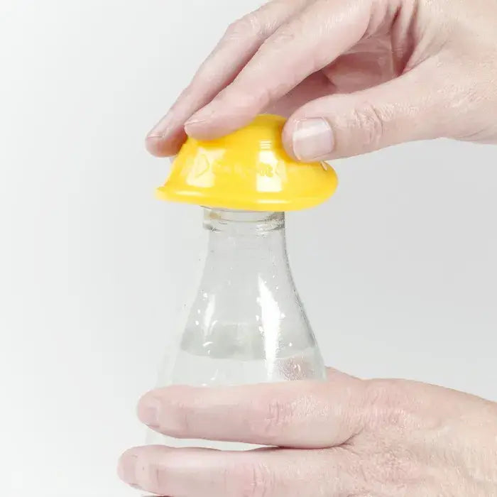 a woman using dycem non slip bottle opener