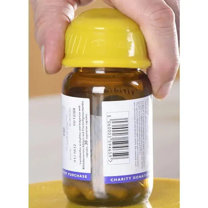 a man using dycem non slip jar opener on a medicine bottle