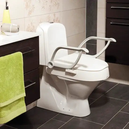 etac cloo toilet seat raiser in a bathroom