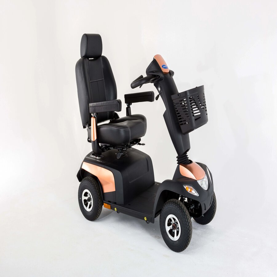 A black and blue Invacare Pegasus Pro mobility scooter with large wheels, a comfortable seat, and a basket in the front from Adaptive Equipment (Image 3).